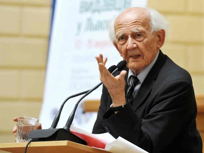 A man on a podium lecturing